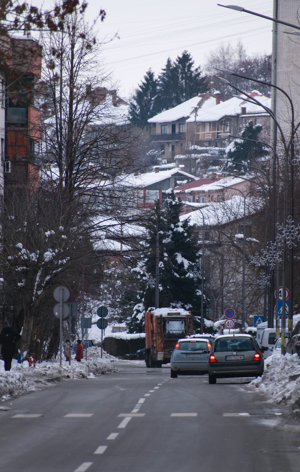 a street with cars and buildings on the side