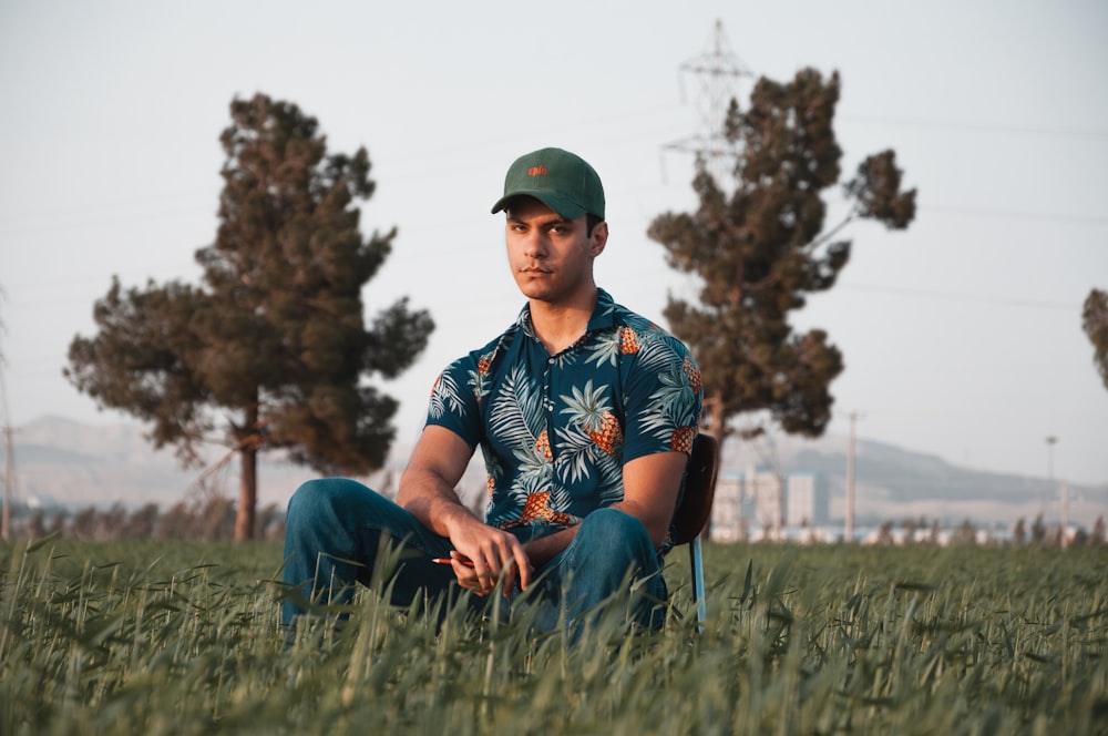 a person sitting in a grassy field