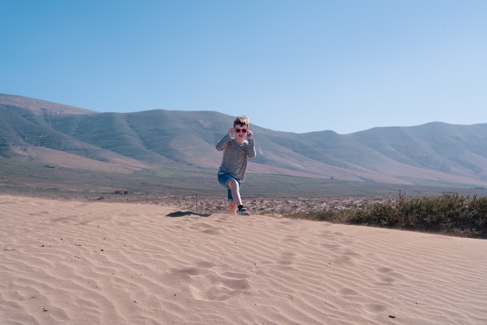 a man standing in a desert