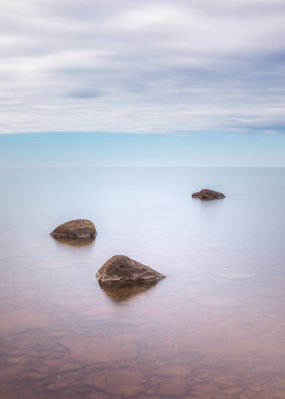 a group of rocks in the water