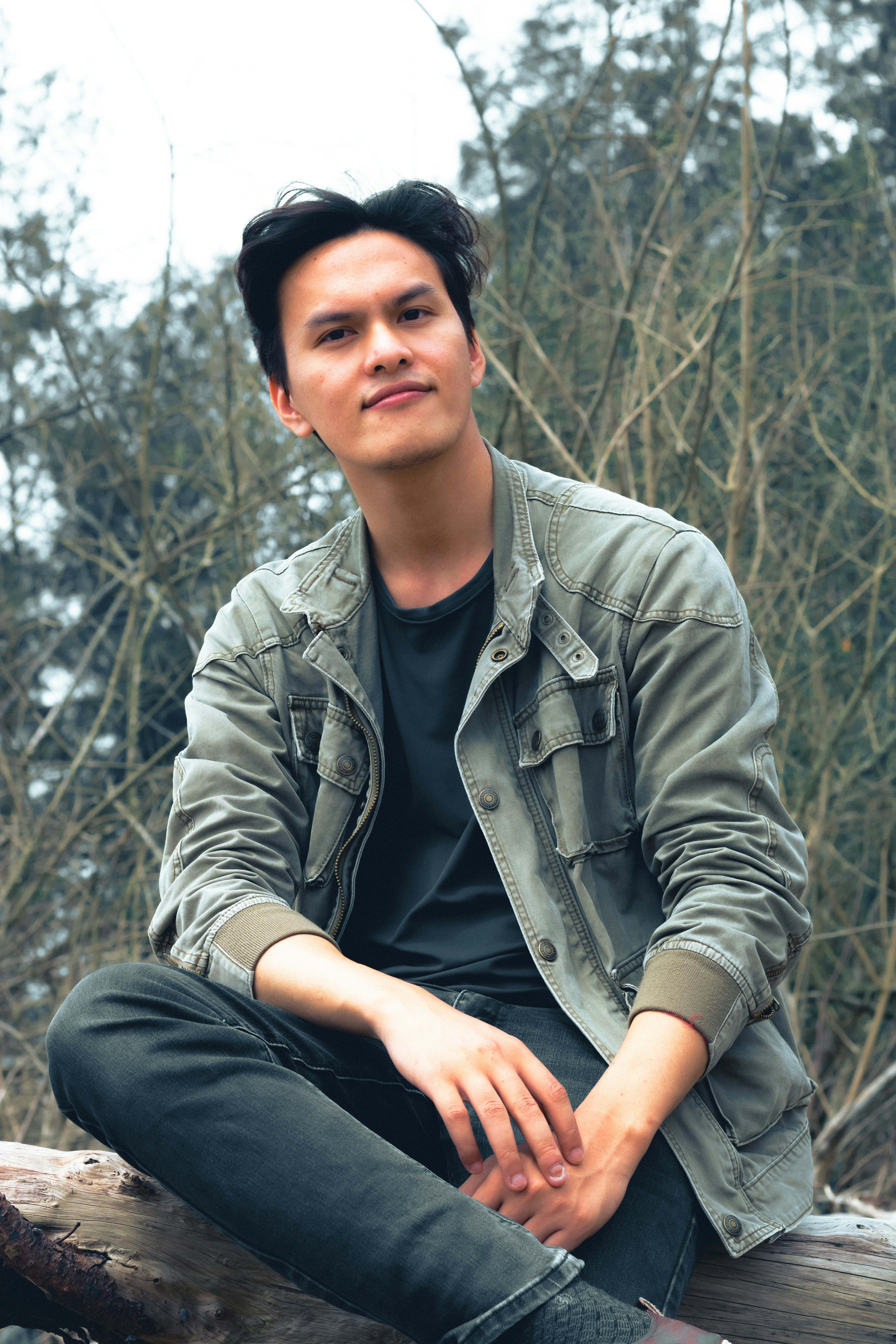 a person sitting on a log