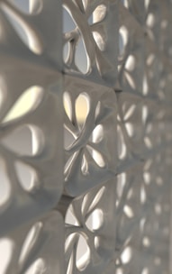 Detail close-up material dinding dengan efek glass dan metalik pastel.