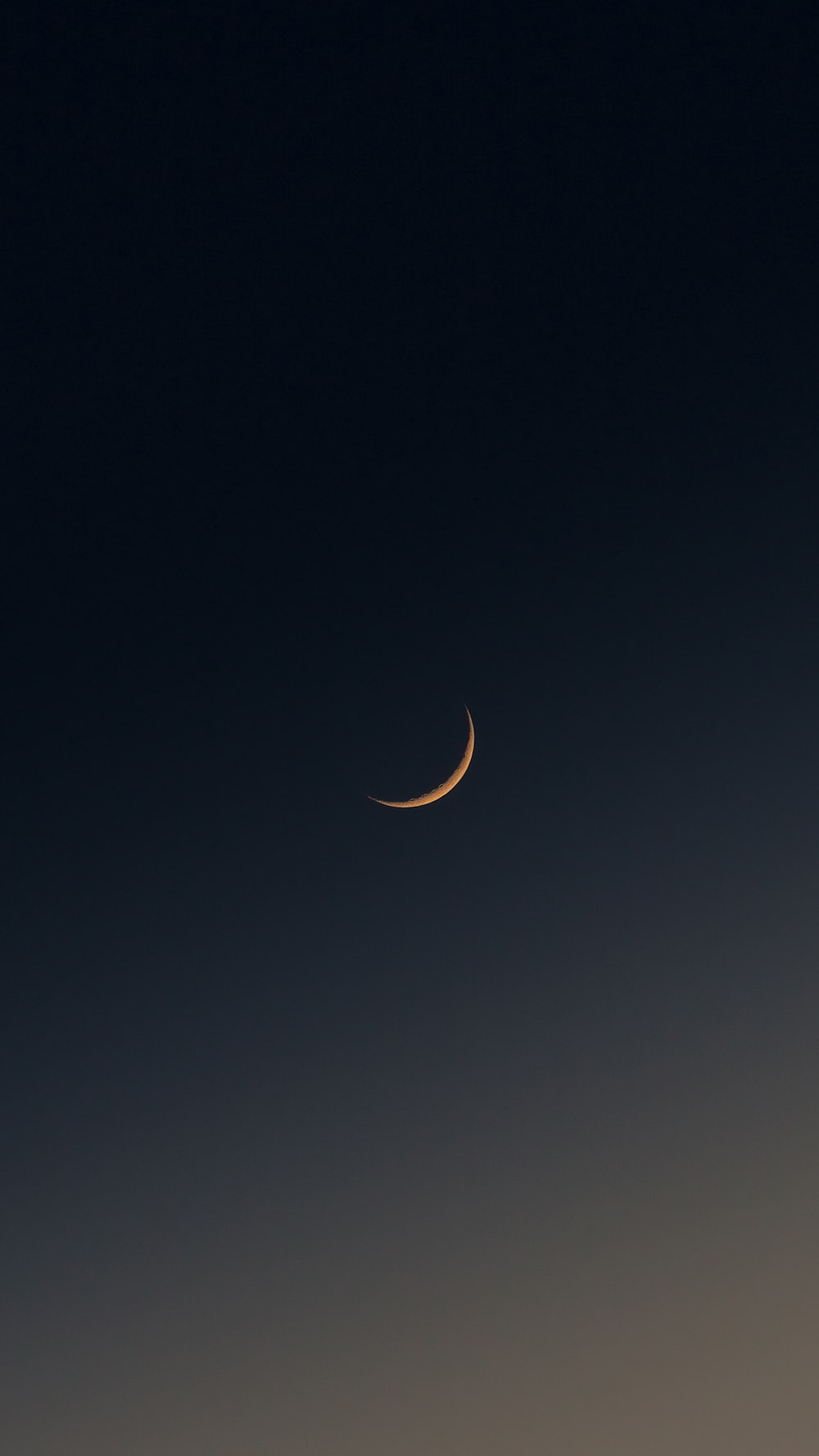 a crescent moon in the sky