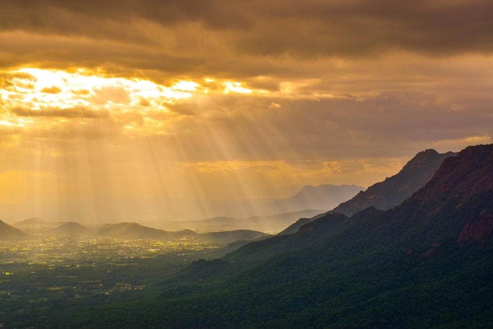 a landscape with hills and clouds