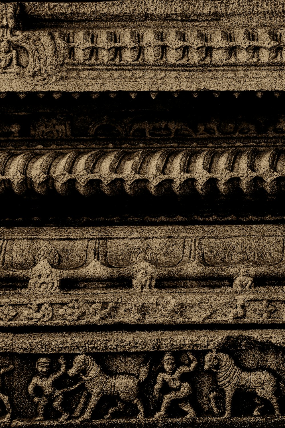 a stone wall with carvings