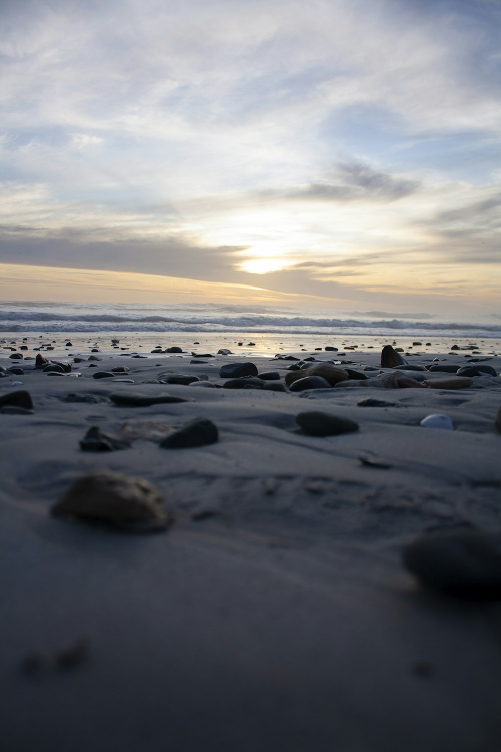 a beach with rocks and water