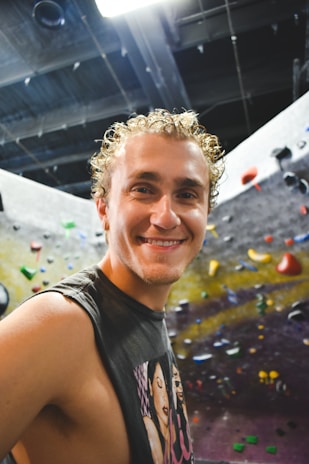 Smiling teenager showing progress on a mental strength chart with a coach.