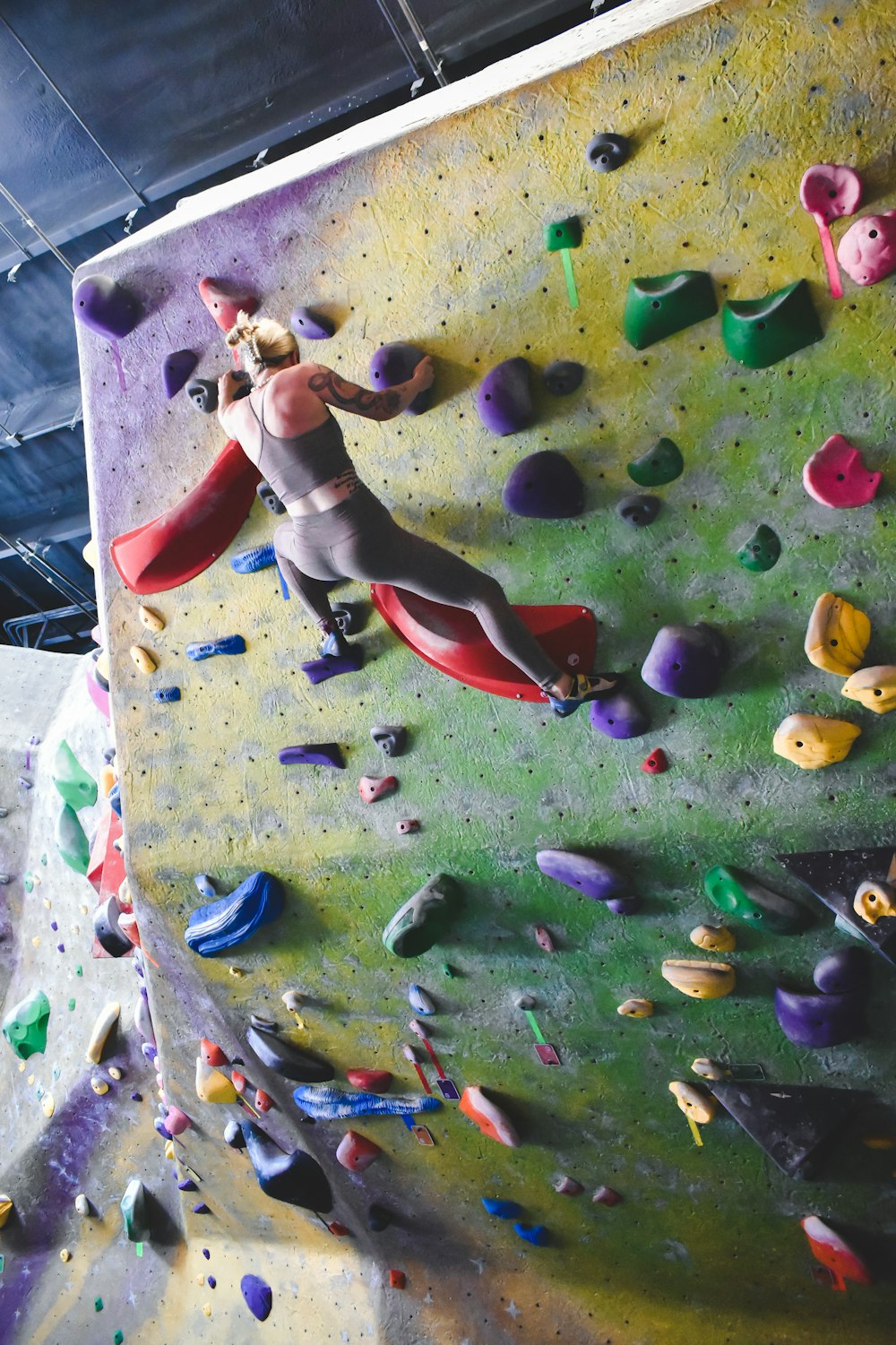 a child climbing a rock wall