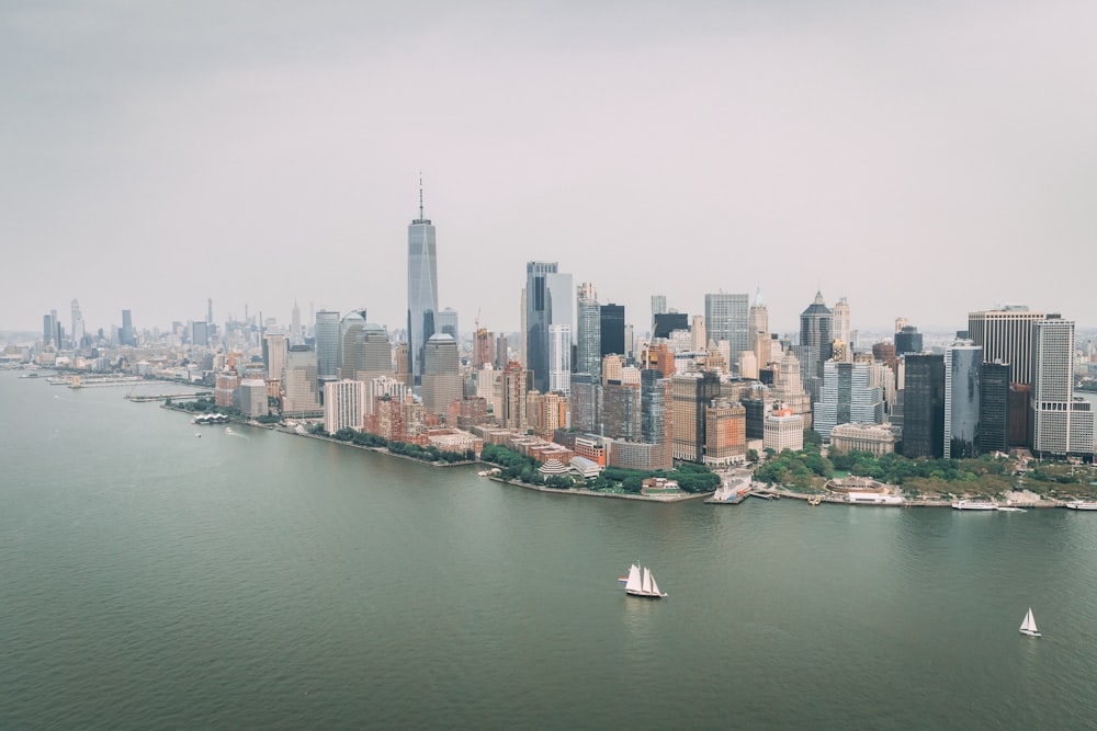 a city skyline with boats