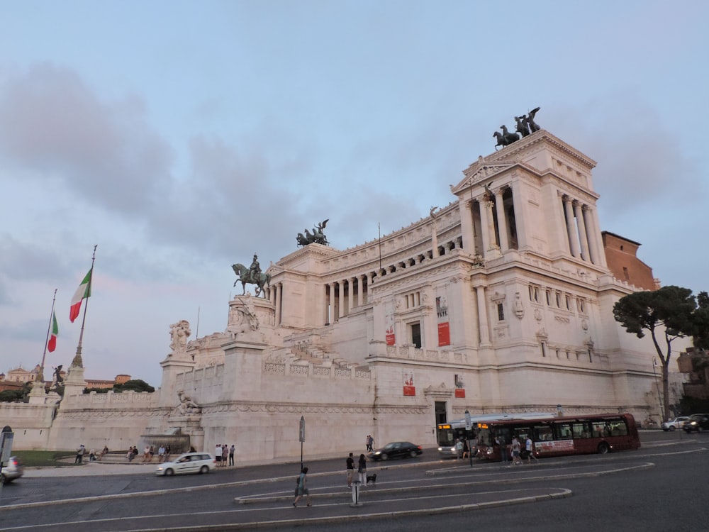 a large stone building with a statue on top