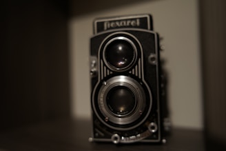 Classic twin-lens reflex camera angled to show intricate mechanical details.