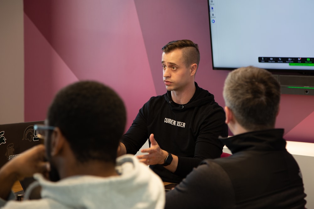 a man talking to a group of people