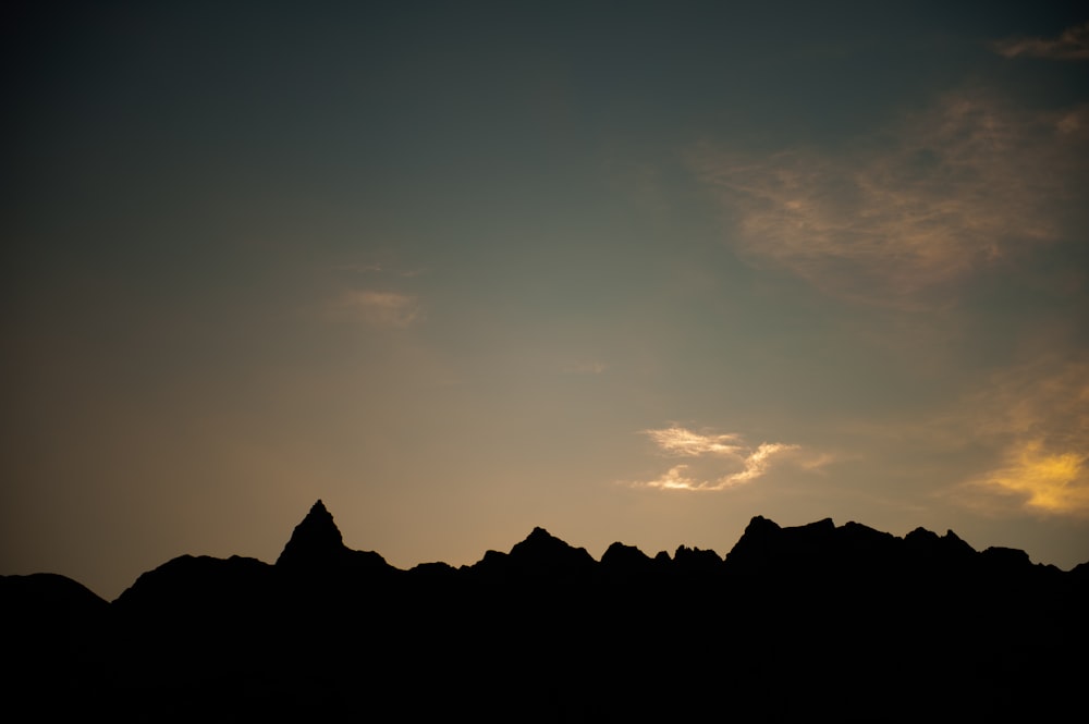 a silhouette of a mountain