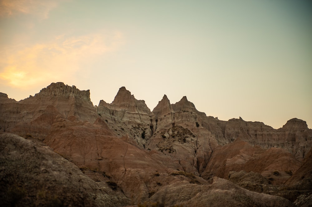 a rocky mountain with a sunset