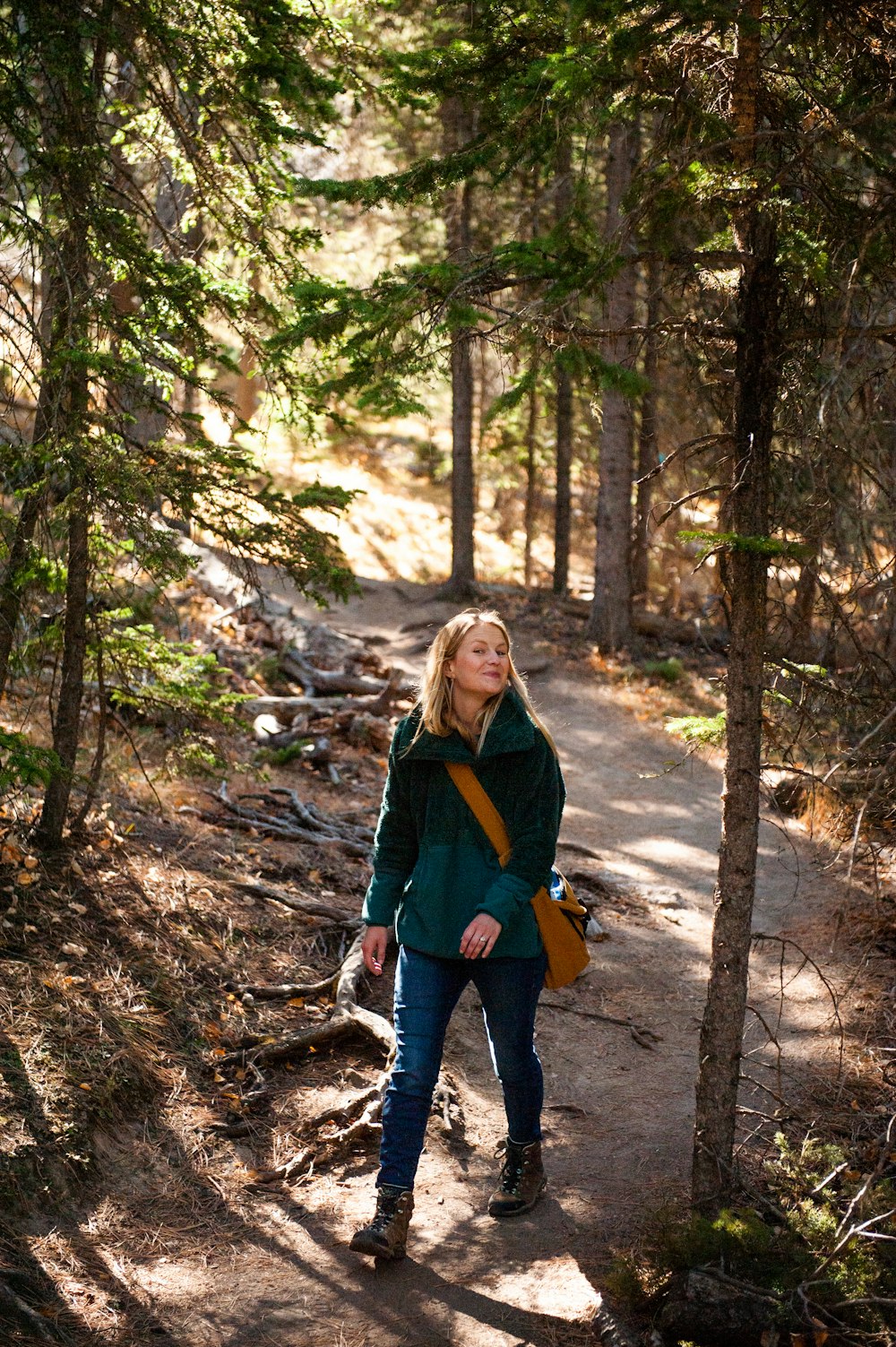 a person walking on a trail in the woods