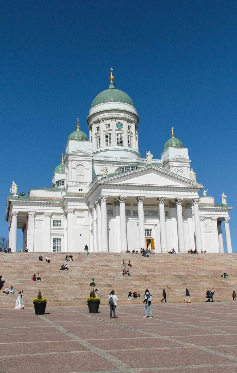 a large white building with columns and a dome