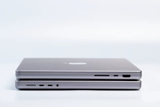 Side-by-side comparison of two laptops with specs highlighted.