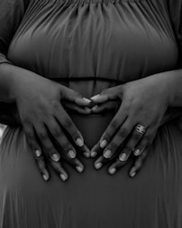 Hands gently resting on chest and belly, feeling the breath flow.