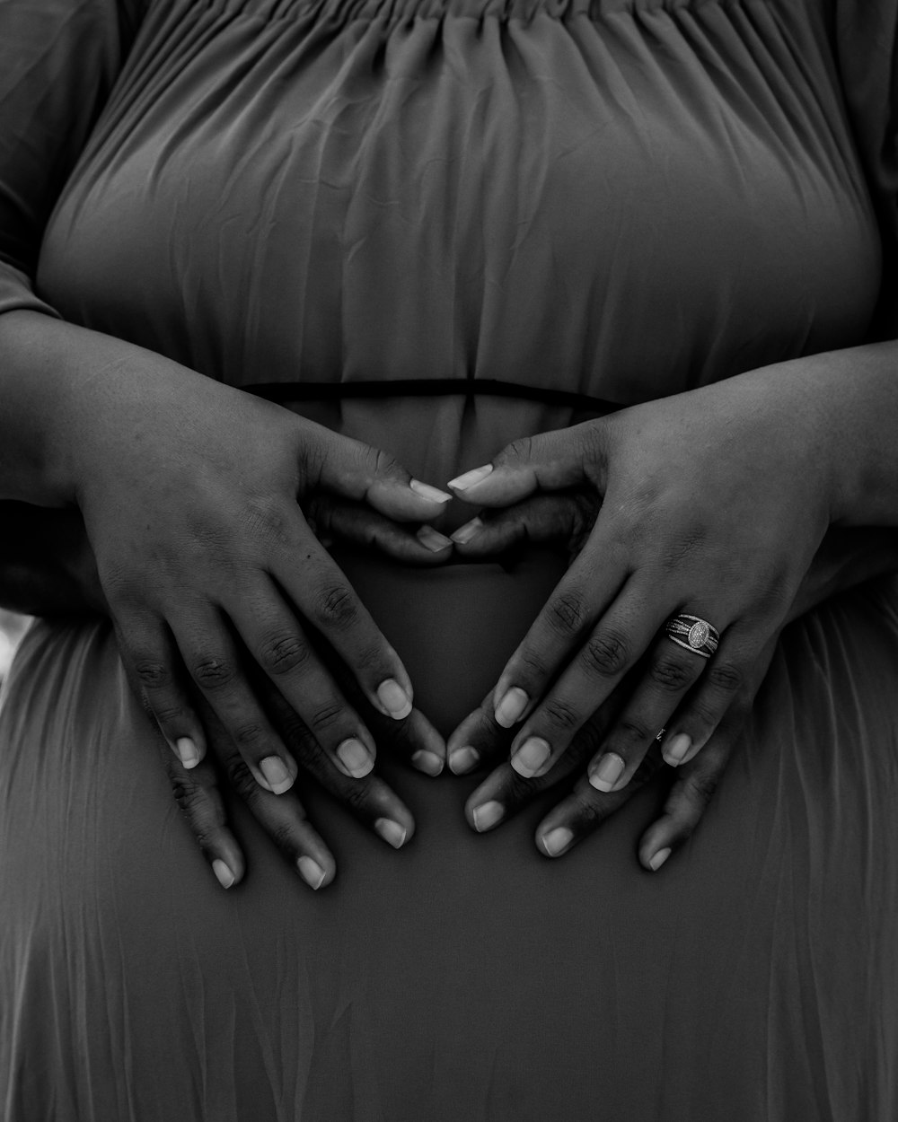 a close-up of hands clasped