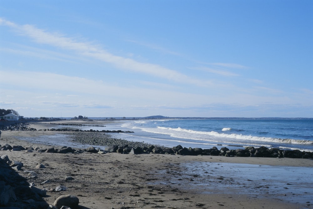 a rocky beach with waves crashing