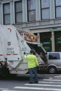 a man standing next to a truck