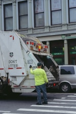 a man standing next to a truck