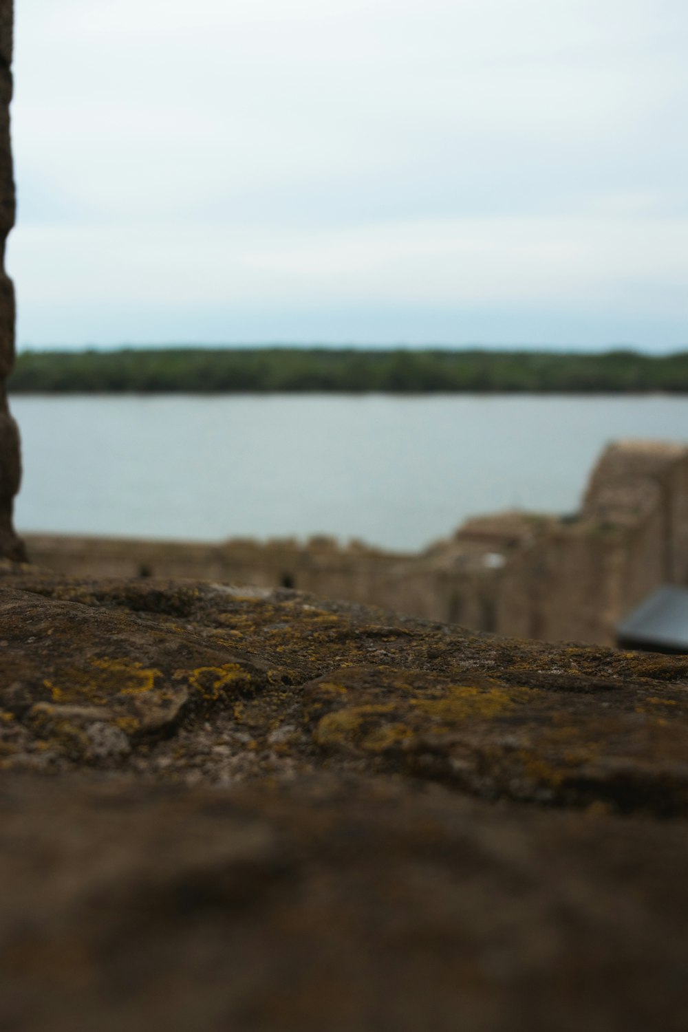 a view of a lake from a cliff