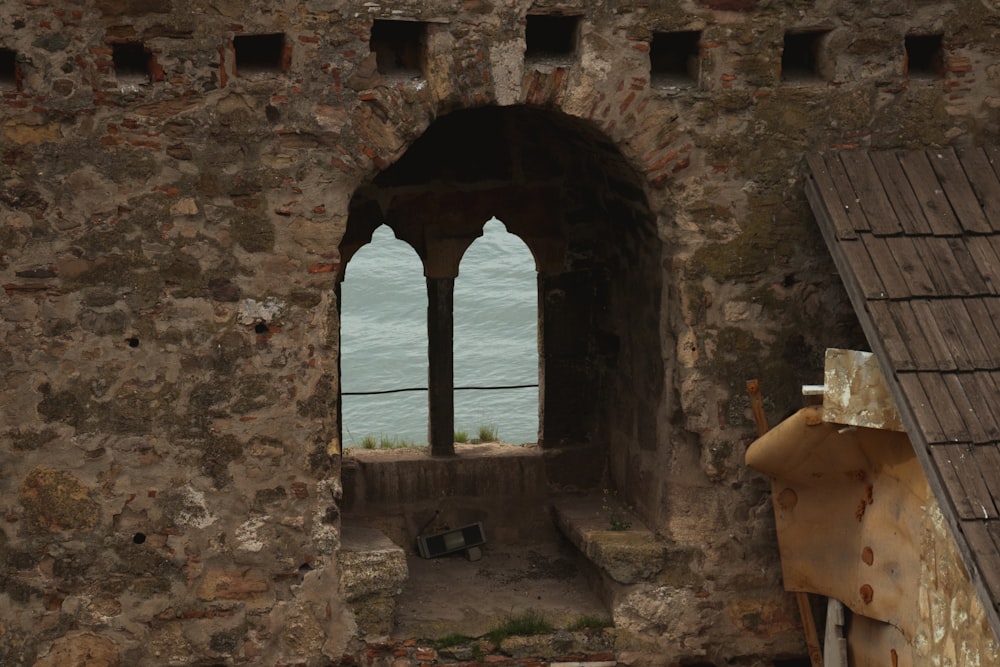 a stone building with a large arched window