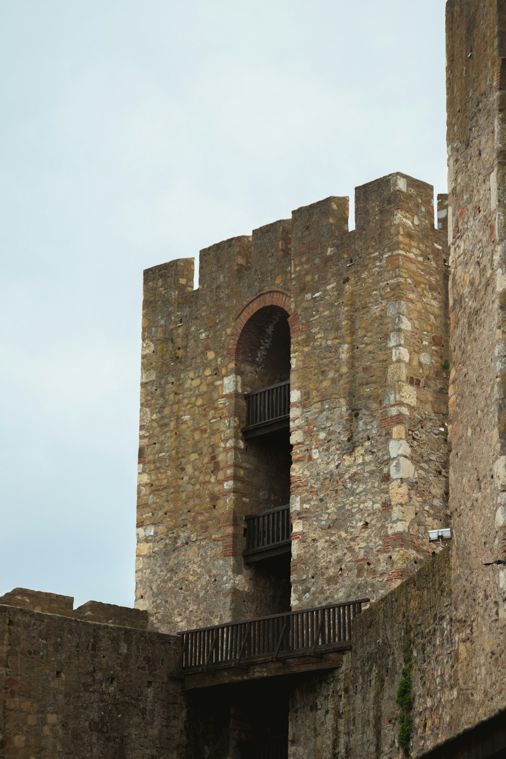 a stone building with a balcony