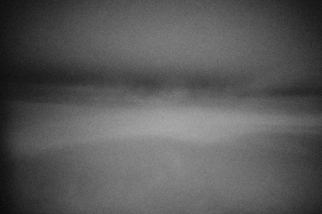 Dynamic editorial spread showing subtle pan and scale effects on a grayscale image that reveals color on hover.