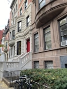 Close-up of a luxury townhouse entrance with elegant lighting