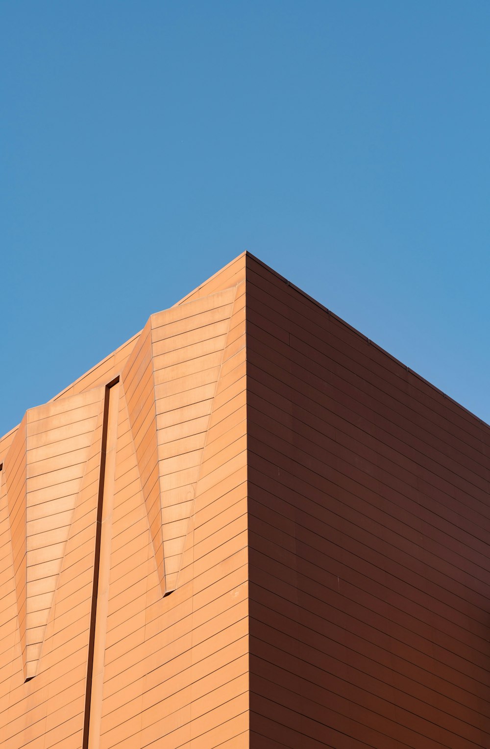 a tall building with a blue sky