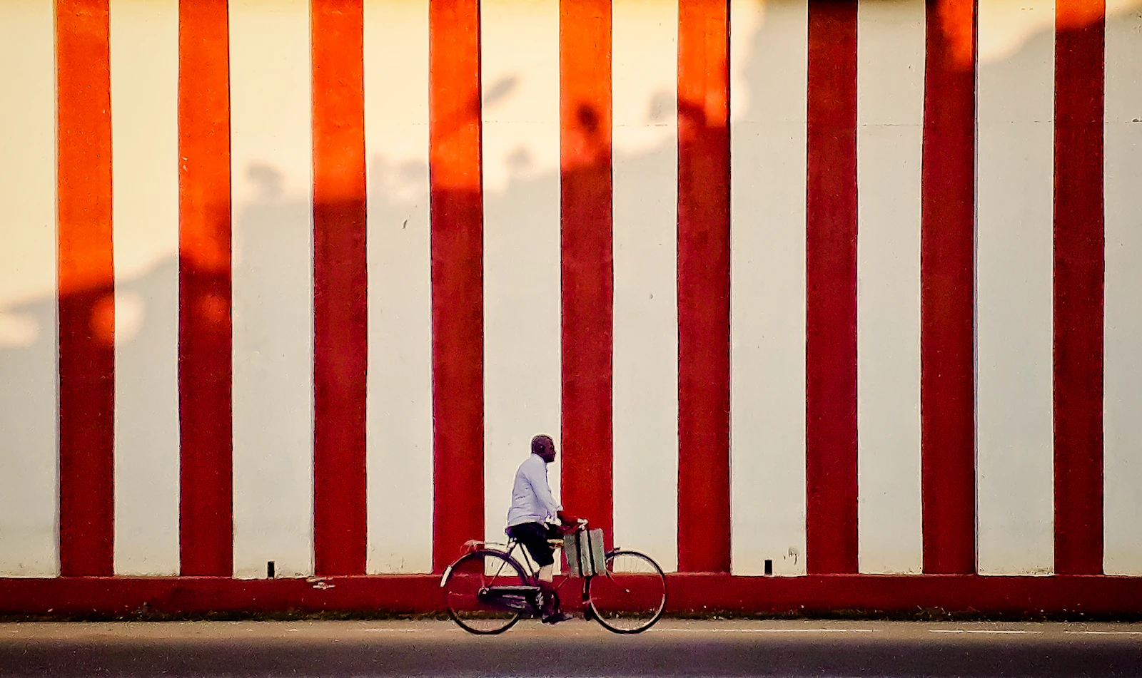Cyclist on a quiet road in the Jaffna peninsula