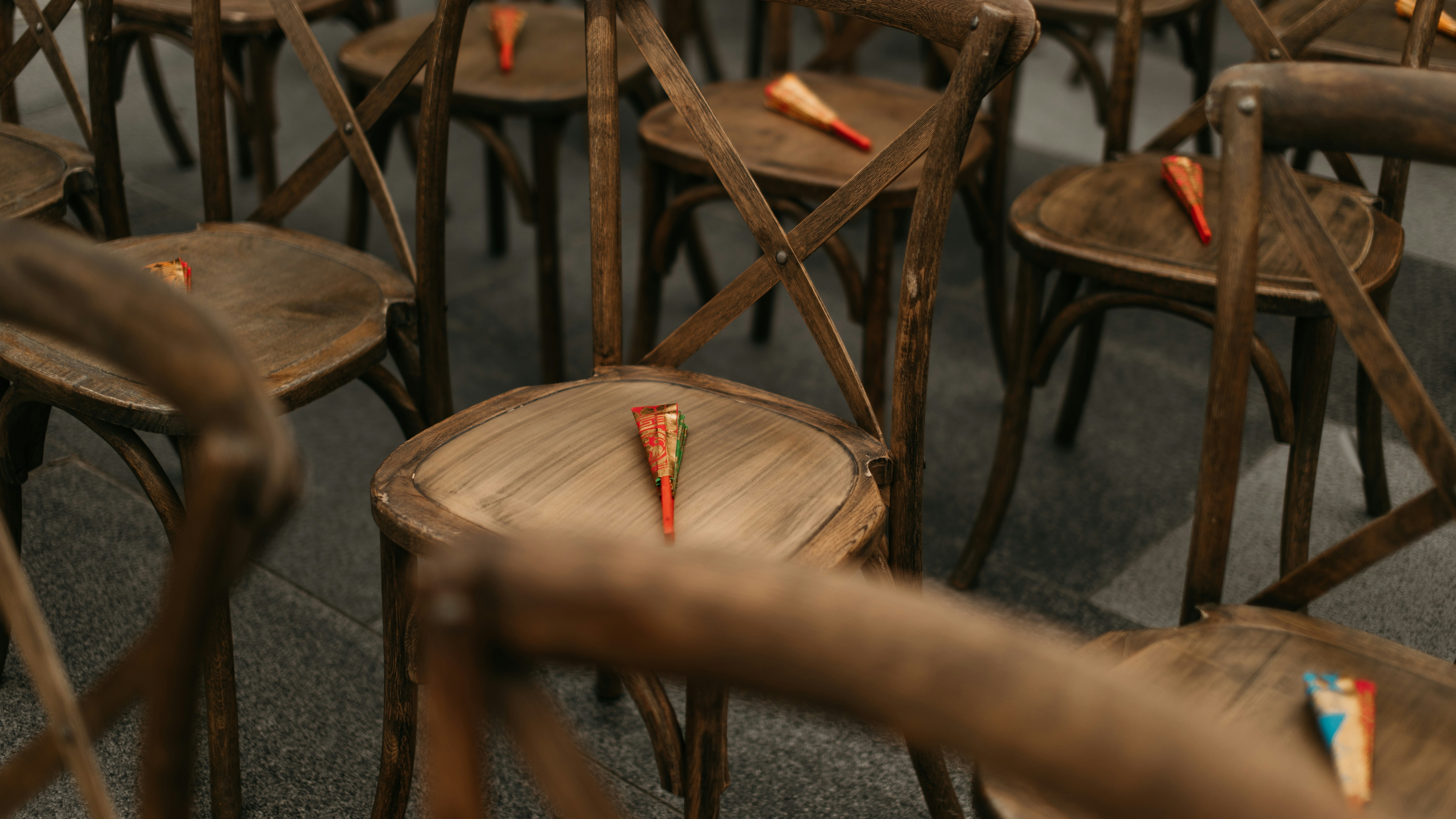a person holding a small candle