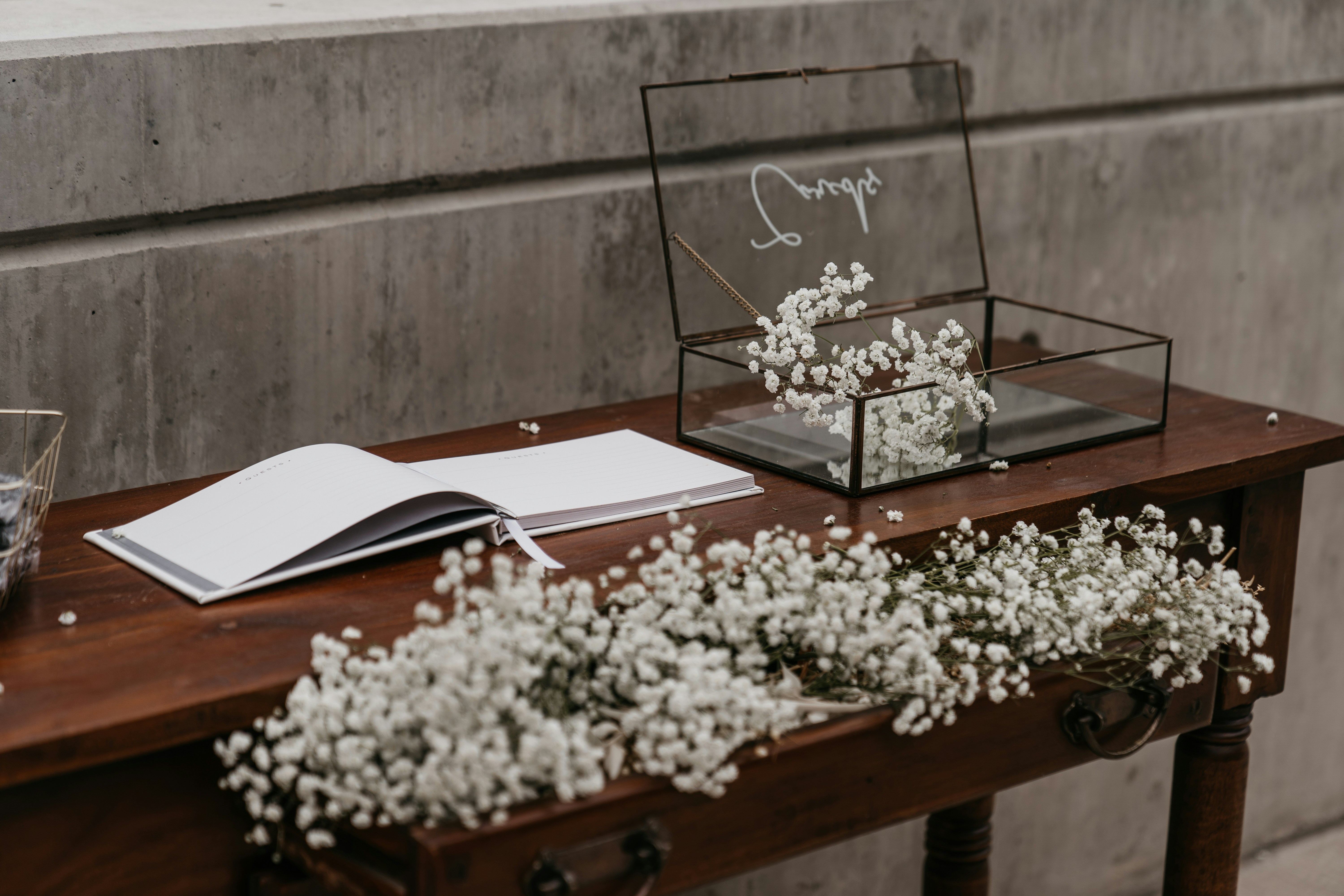 Elegant pricing table with flowers and book