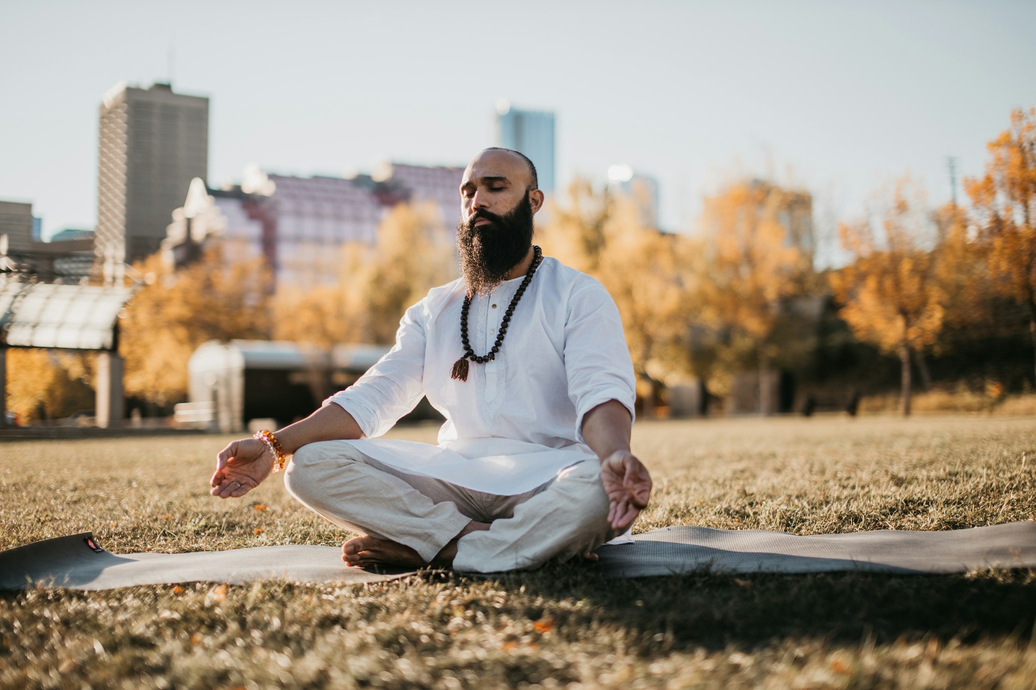 Person meditating in peaceful setting