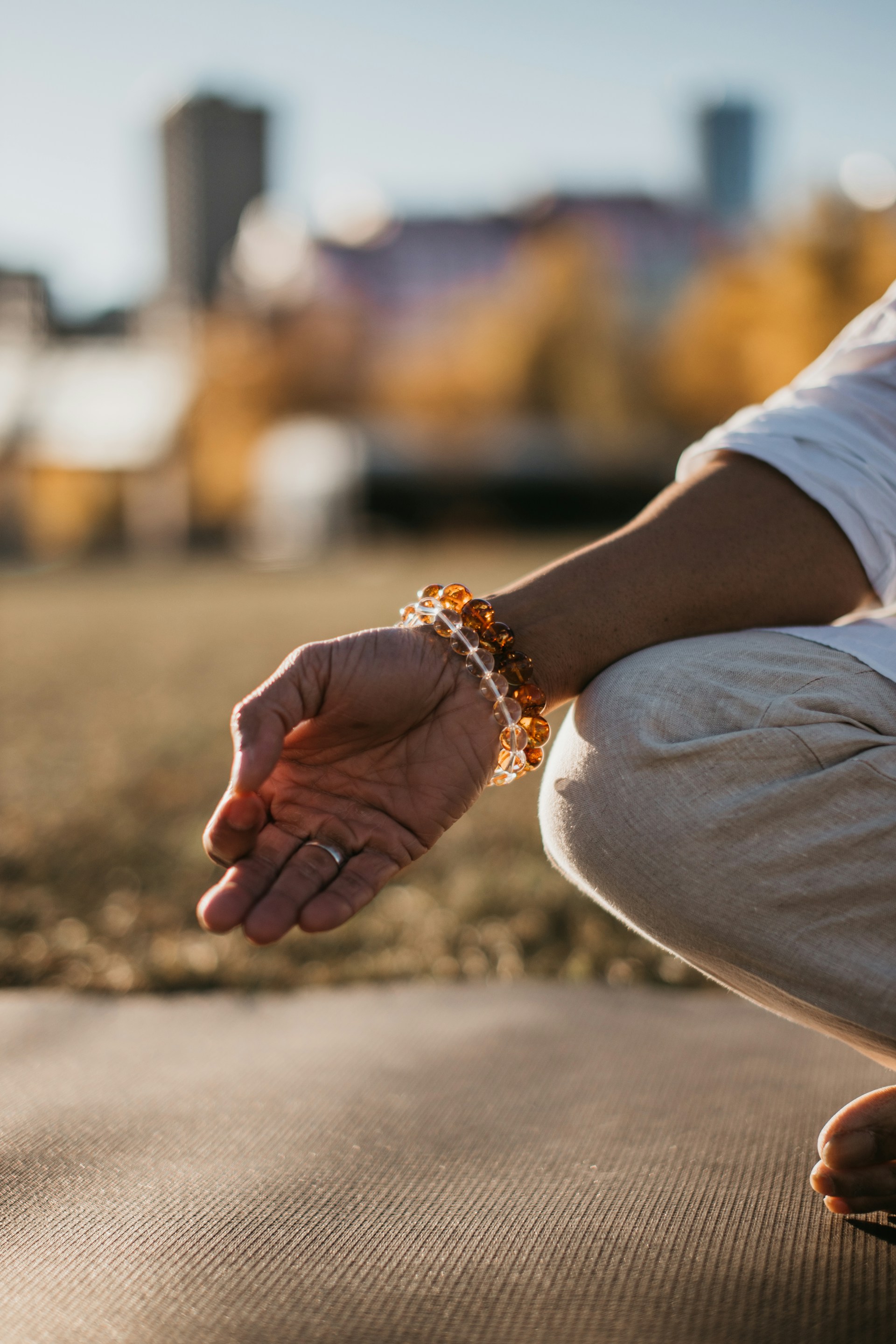 a person's hand on a beach