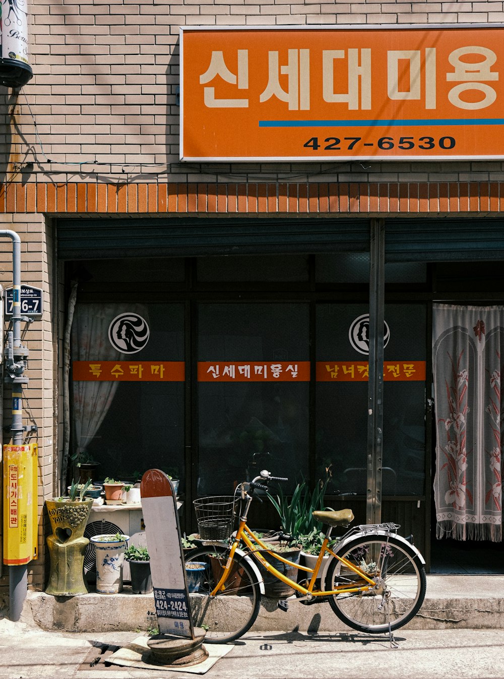 a bicycle parked in front of a store