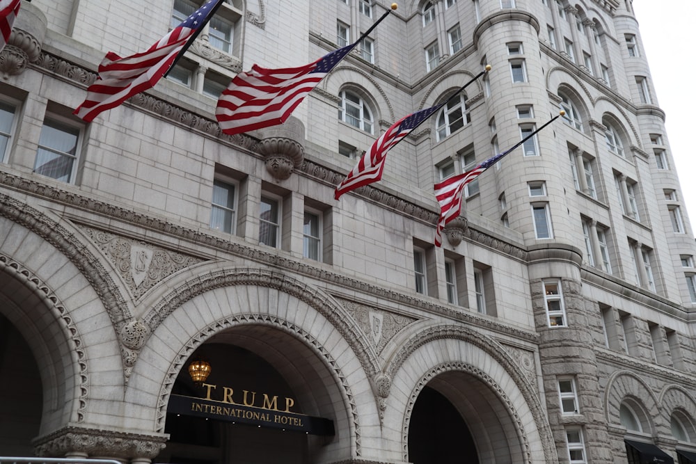 a building with flags on the front