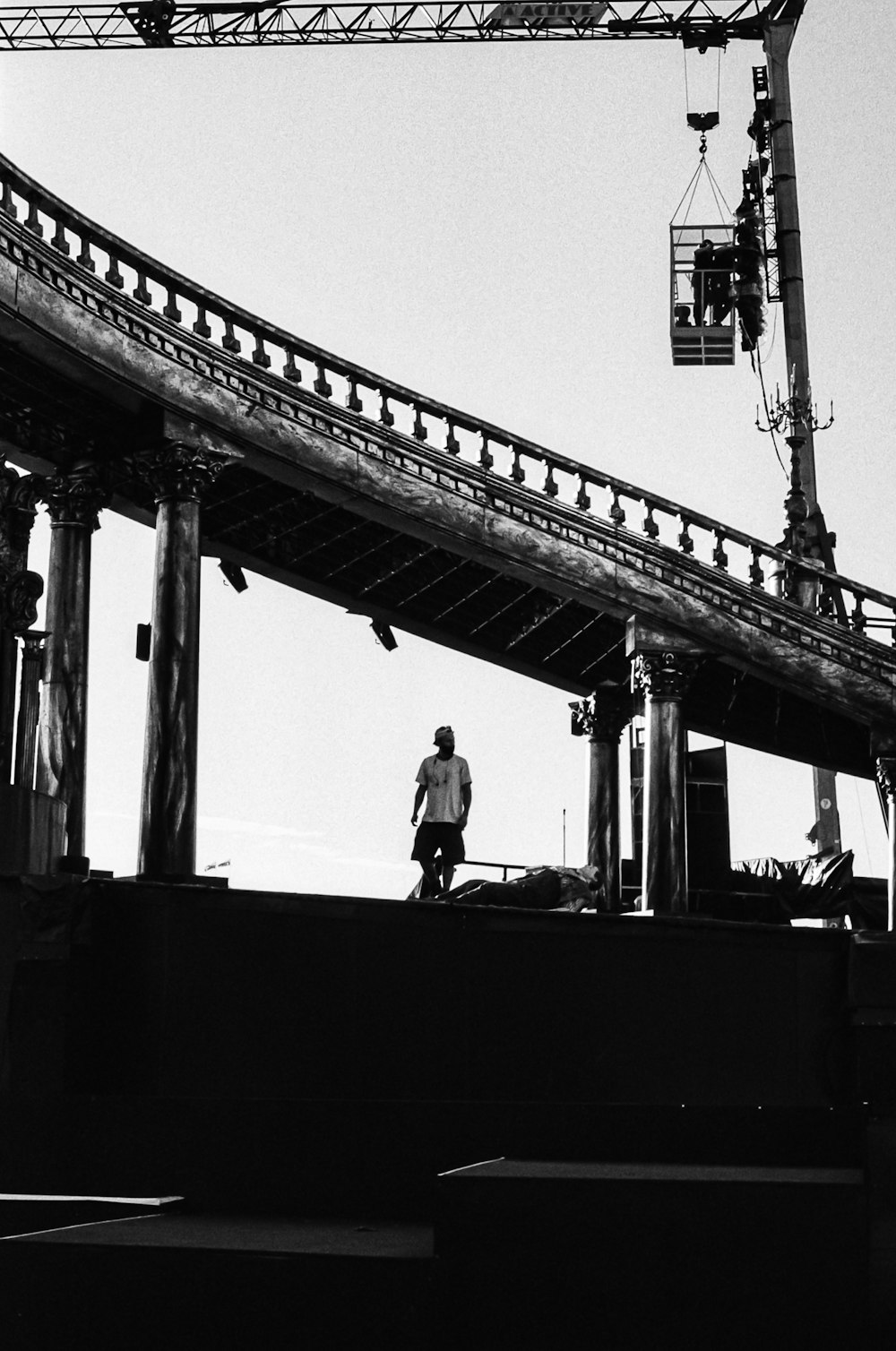 a person standing on a bridge