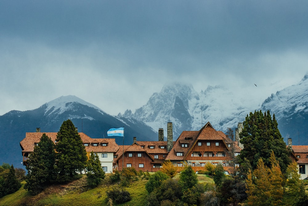 a large building with a mountain in the background