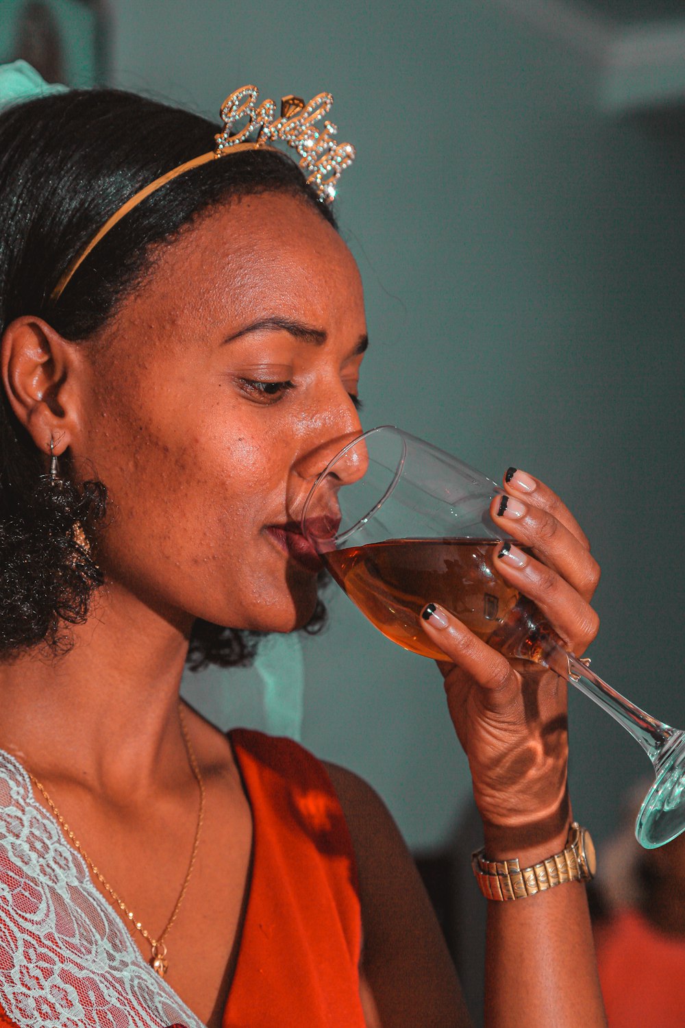 a person drinking a glass of wine