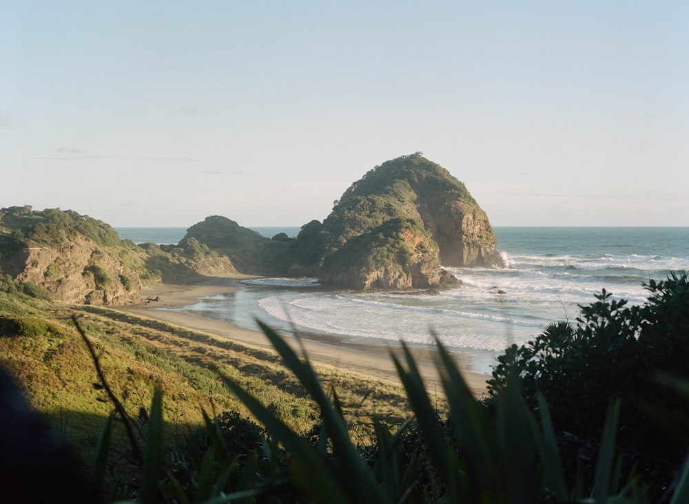 a beach with a few large rocks