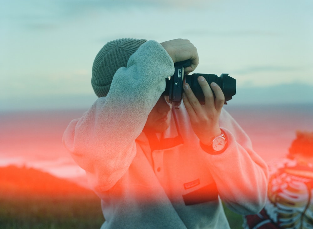 a person holding a camera