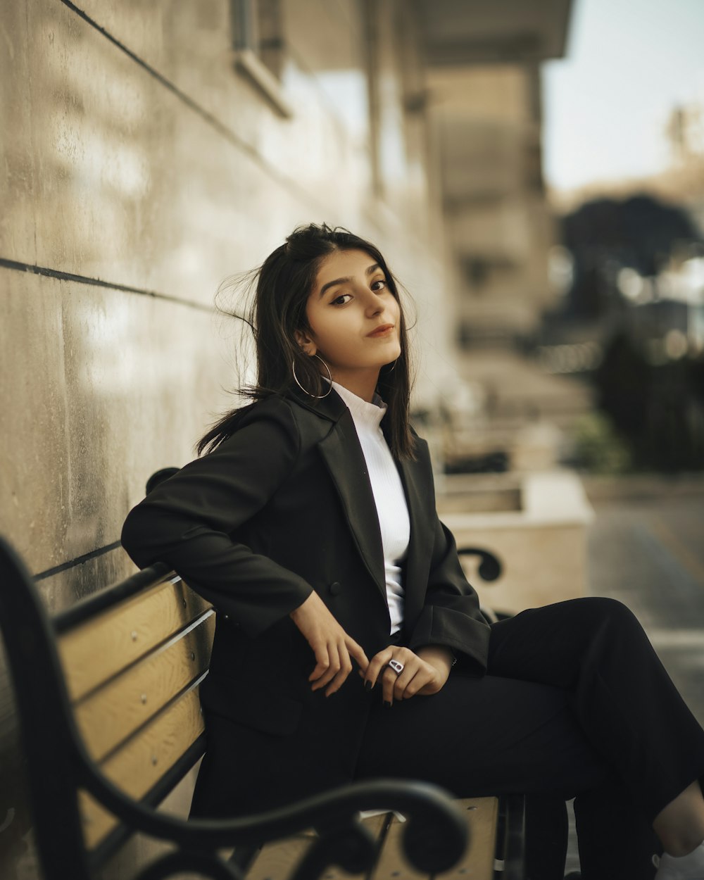 a woman sitting on a bench