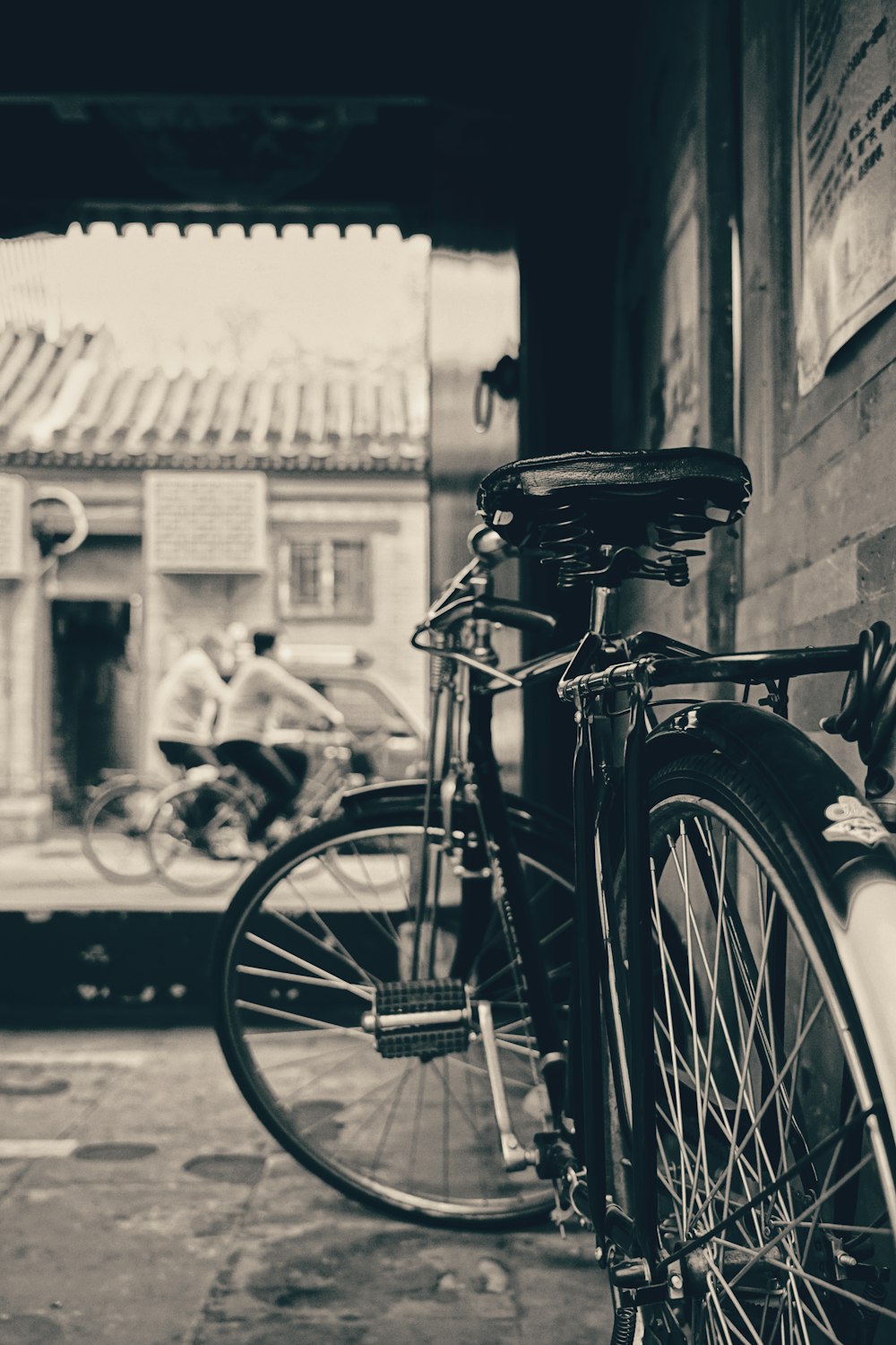 a bicycle parked on a sidewalk