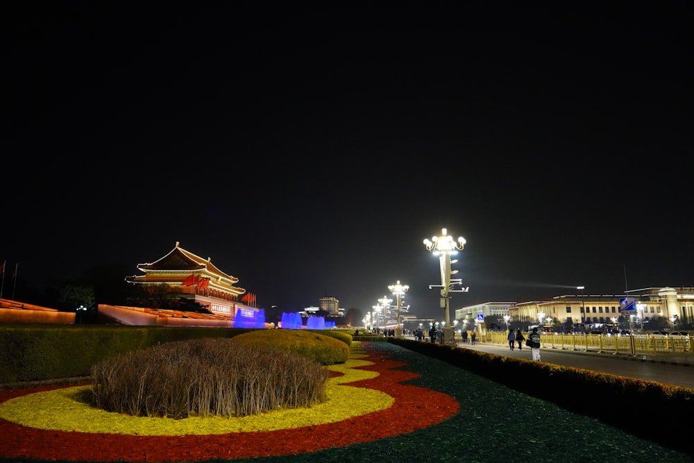 a large building with a large pointed roof at night