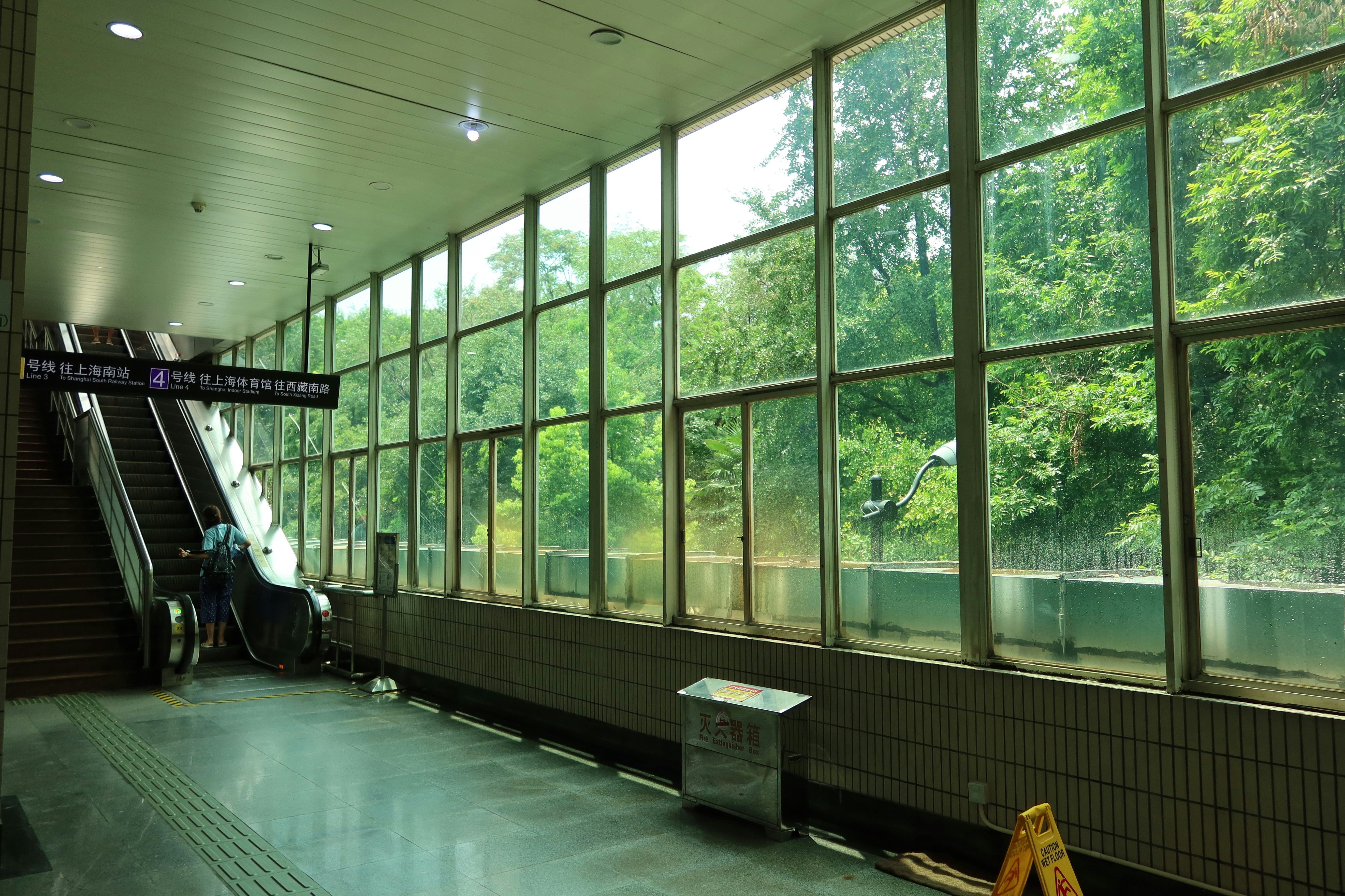 Shanghai metro station entrance with modern signage, showing the urban transit environment travelers use to reach the Bund