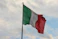 a couple of flags on a flagpole