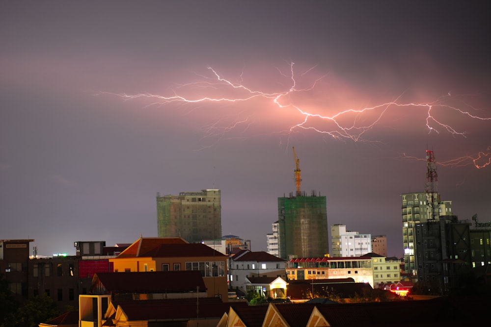 a city with lightning striking the ground